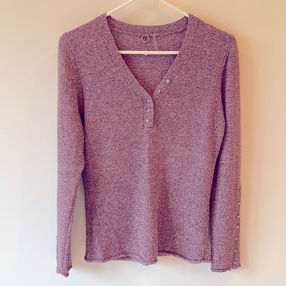 One Girl Who…sparkle v-neck sweater pink with flower gem button details.